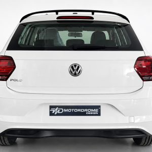 A-457_3jpg - OPSHOLDERS Rear view of a white Volkswagen Polo with VW badge, showing taillights and Motordrome Design plate on the bumper.