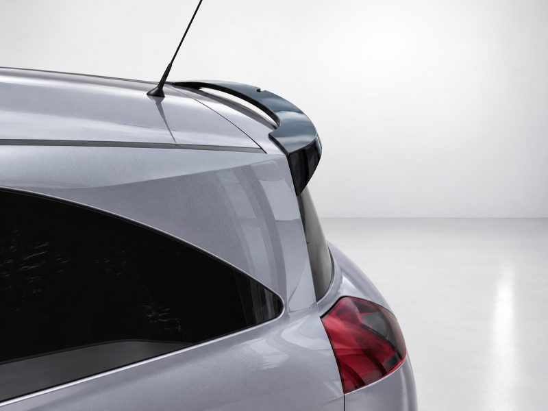 A-459_3jpg - OPSHOLDERS Rear view of a silver hatchback showing the raised spoiler above the rear window and an antenna on the roof rail
