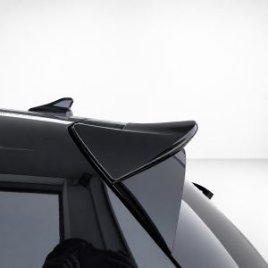 A-464_3jpg - OPSHOLDERS Close-up of a glossy black car rear spoiler and roof edge, highlighting aerodynamic design.