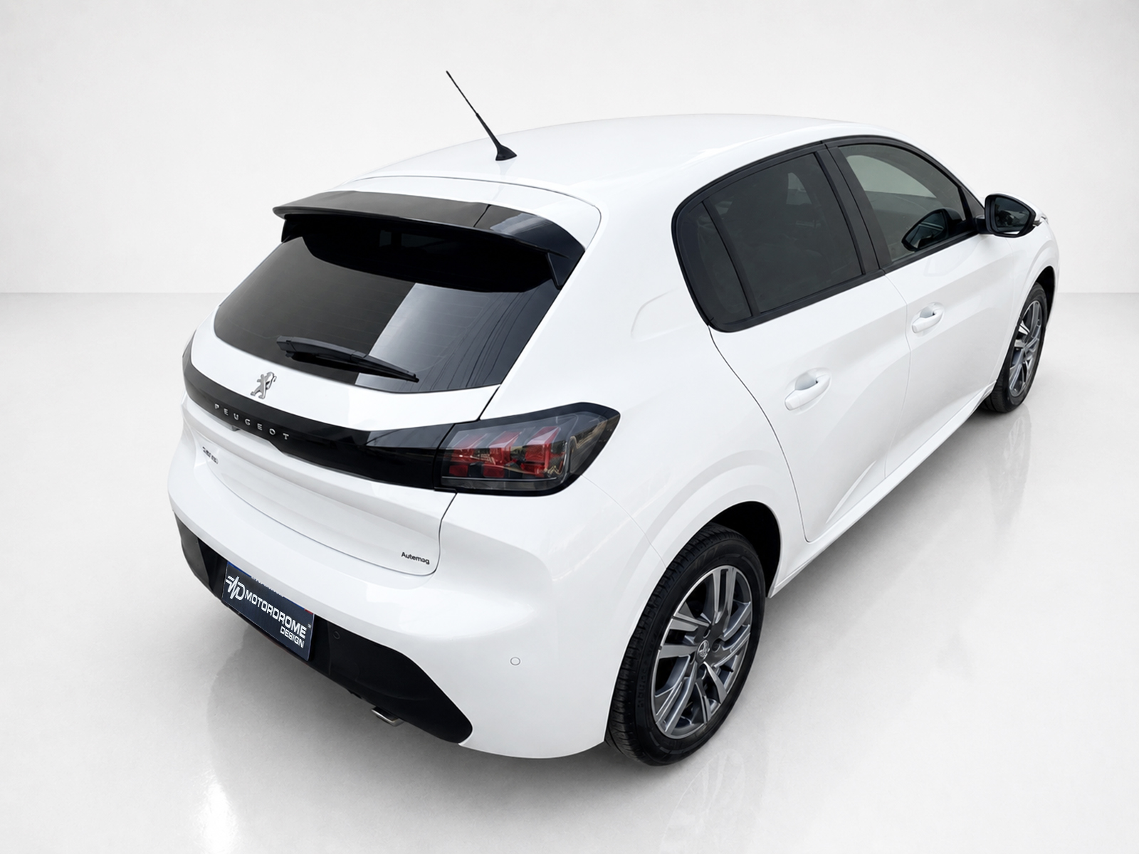A-465_2jpg - OPSHOLDERS White Peugeot hatchback photographed from the rear-right, showing taillights, rear window, and alloy wheels in a studio setting.