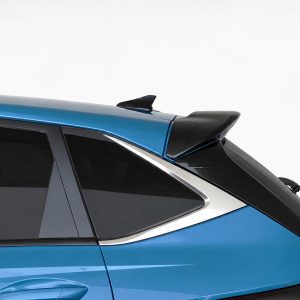Rear side of a blue car showing a black roof spoiler above the rear window with tinted glass and chrome trim.