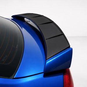 Close-up of a blue hatchback rear with a black spoiler and rear window defroster lines visible on the glass.
