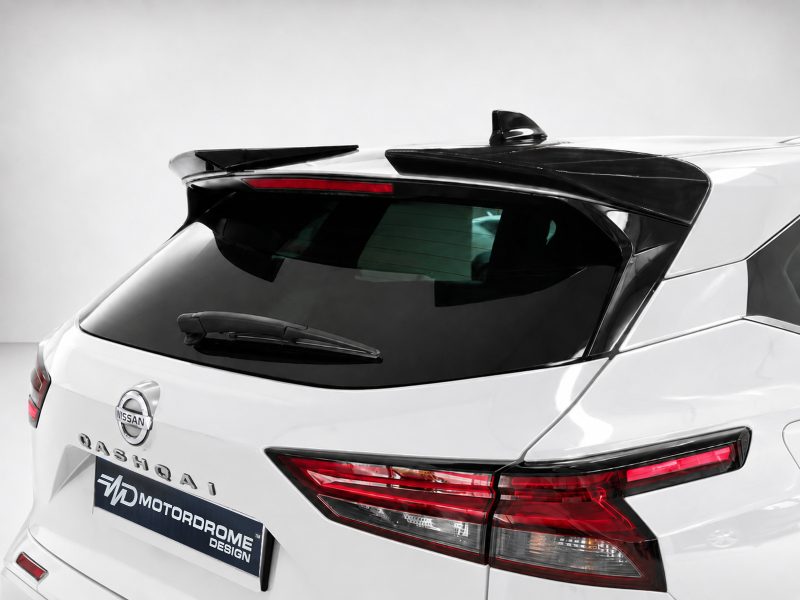 A-471_2jpg - OPSHOLDERS Rear view of a white Nissan Qashqai SUV with a dark rear window, roof spoiler, and wiper visible on the tailgate plate area