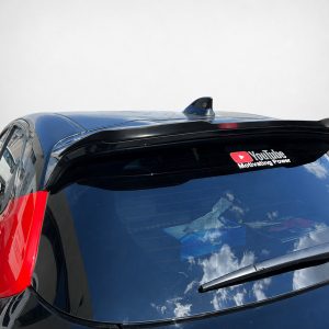 Blue and red car seen from above with a YouTube sticker reading 'YouTube Motivating Power' on the rear window.