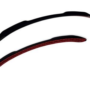A-474_4-1jpg - OPSHOLDERS Two long, curved black objects with red braided inner detailing, laid diagonally on a white background