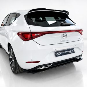 A-475_2jpg - OPSHOLDERS White hatchback viewed from the rear in a studio, showing sleek taillights and a Sporty roof spoiler.