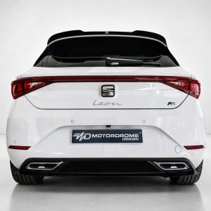 A-475_3jpg - OPSHOLDERS Rear view of a white SEAT Leon FR hatchback with red taillights and a Motordrome Design plate in a studio setting