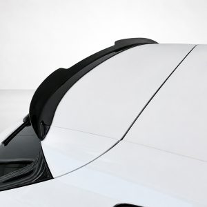 A-475_4jpg - OPSHOLDERS Close-up of a white car roof with black trim along the edge and a small rear spoiler/antenna visible at the top-right corner.