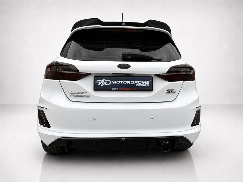 A-476_3jpg - OPSHOLDERS Rear view of a white hatchback with a large black rear spoiler and dark taillights on a light background.