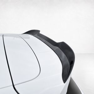 A-476_4jpg - OPSHOLDERS Close-up of the rear of a white car showing a black spoiler and rear wiper.