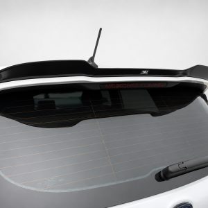 A-476_5jpg - OPSHOLDERS Rear of a white car showing a glossy black spoiler, antenna, and a 'MICROCHIPS TUNING' badge above the rear window with defroster lines visible.