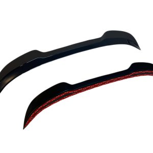 A-476_6jpg - OPSHOLDERS Pair of black, curved, blade-like components with a red interior edge, shown against a white background (aerodynamic fins or brackets).