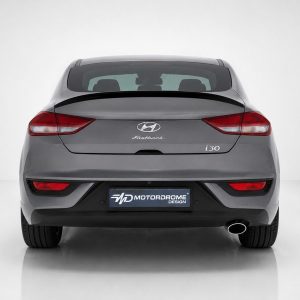 Rear view of a gray Hyundai i30 Fastback, showing taillights and the Motordrome Design plate on the bumper bed.