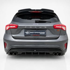 A-479_3jpg - OPSHOLDERS Rear view of a gray Ford Focus ST hatchback with quad exhausts and a Motordrome Design plate, Ford Performance badge visible