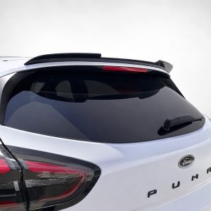 Rear view of a white Ford Puma with a roof spoiler and tinted rear window