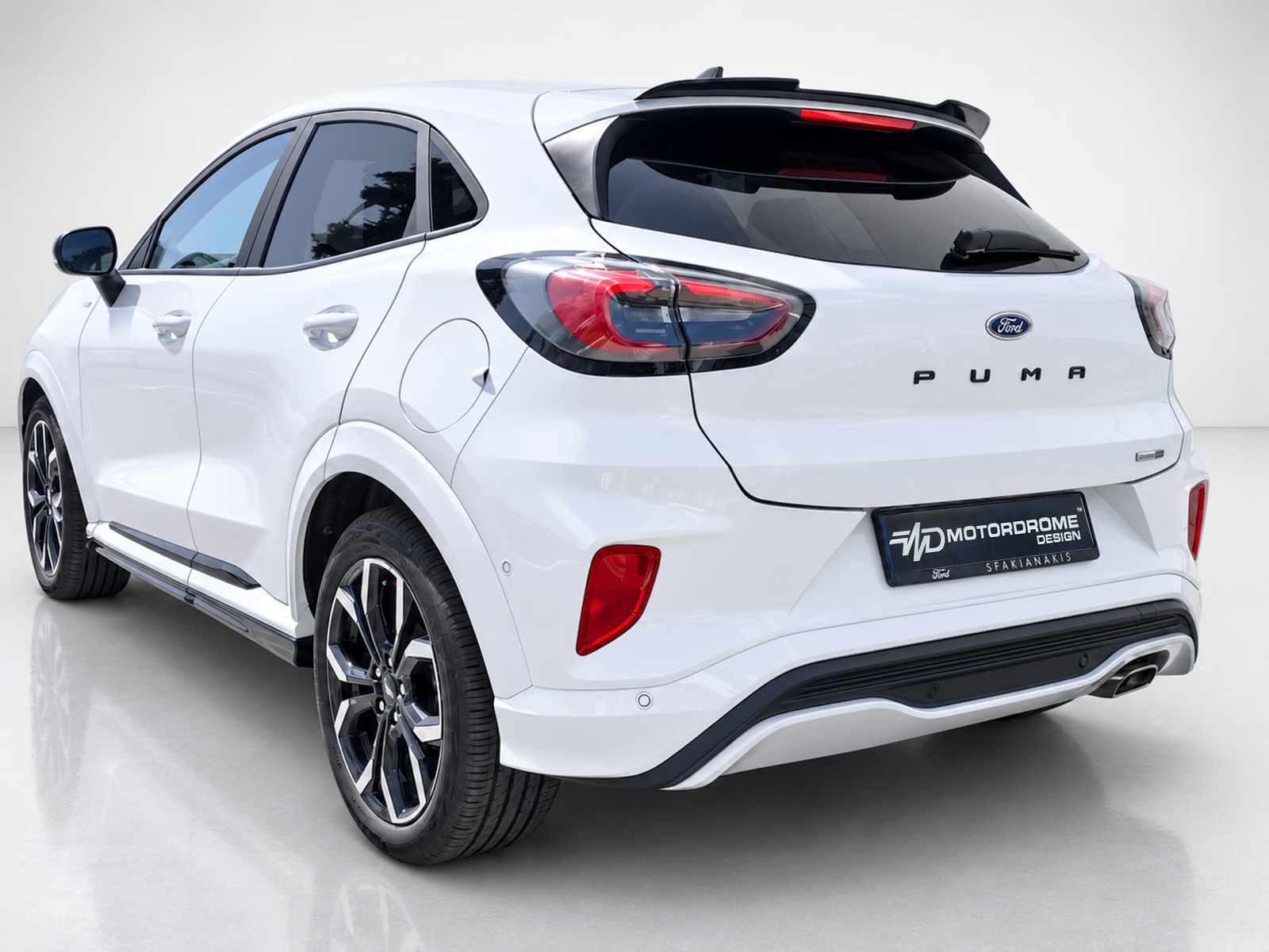 A-481_2jpg - OPSHOLDERS White Ford Puma SUV rear view with taillights and sporty bumper, on a light showroom floor.