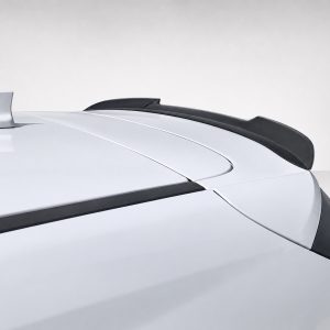 A-481_3jpg - OPSHOLDERS Close-up of a white car roof with a black rear spoiler and sleek body lines against a light background.