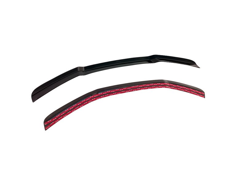 Pair of automotive windshield wiper blades, one black and one red-striped, shown curved for fit on a vehicle windshield