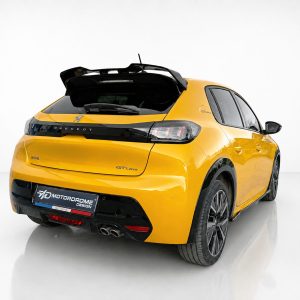 Yellow Peugeot 208 GTLine hatchback photographed from the rear left with the boot lid open in a studio setting on a white background