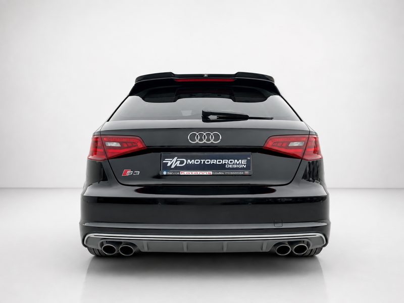 A-487_3jpg - OPSHOLDERS Rear view of a black Audi S3 hatchback showing the Audi rings and dual-tone rear bumper with exhausts and a Motordrome Design plate plate area.