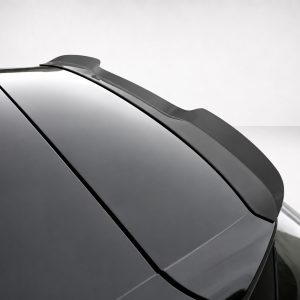 A-487_4jpg - OPSHOLDERS Close-up of a sleek spoiler on a glossy black car's rear edge