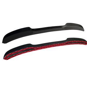 A-487_6jpg - OPSHOLDERS Two black curved automotive trim mouldings with red 3M adhesive backing visible underneath the tape edge.