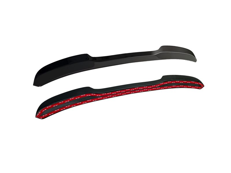 A-487_6jpg - OPSHOLDERS Two black curved automotive trim mouldings with red 3M adhesive backing visible underneath the tape edge.