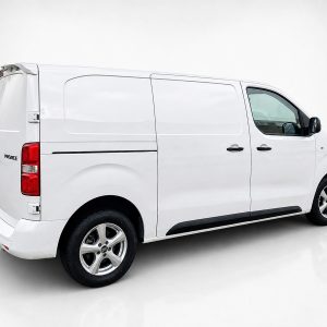 A-488_3jpg - OPSHOLDERS White cargo van photographed from the rear-right, showing side panel and wheels in a studio setting.