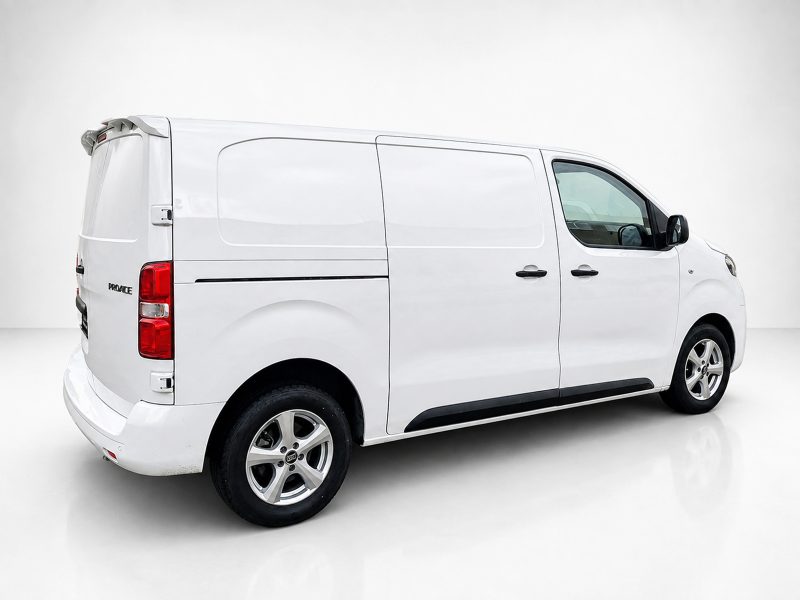 A-488_3jpg - OPSHOLDERS White cargo van photographed from the rear-right, showing side panel and wheels in a studio setting.
