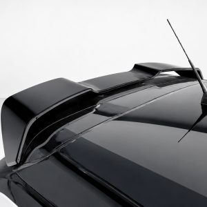 Close-up of a glossy black car roof with a small rear spoiler and a rooftop antenna.