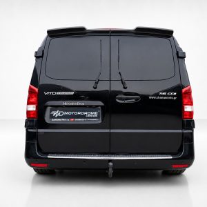 Rear view of a black Mercedes-Benz Vito Tourer van with two back doors, wipers, and a branded rear plate area.