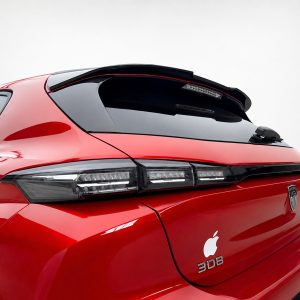 A-492_4jpg - OPSHOLDERS Red hatchback rear with black roof spoiler, sleek LED taillights, and an Apple logo decal on the trunk badge area
