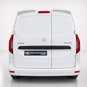 Rear view of a white Mercedes van with split rear doors, red taillights, and a MD Motordome Design plate badge above the bumper.