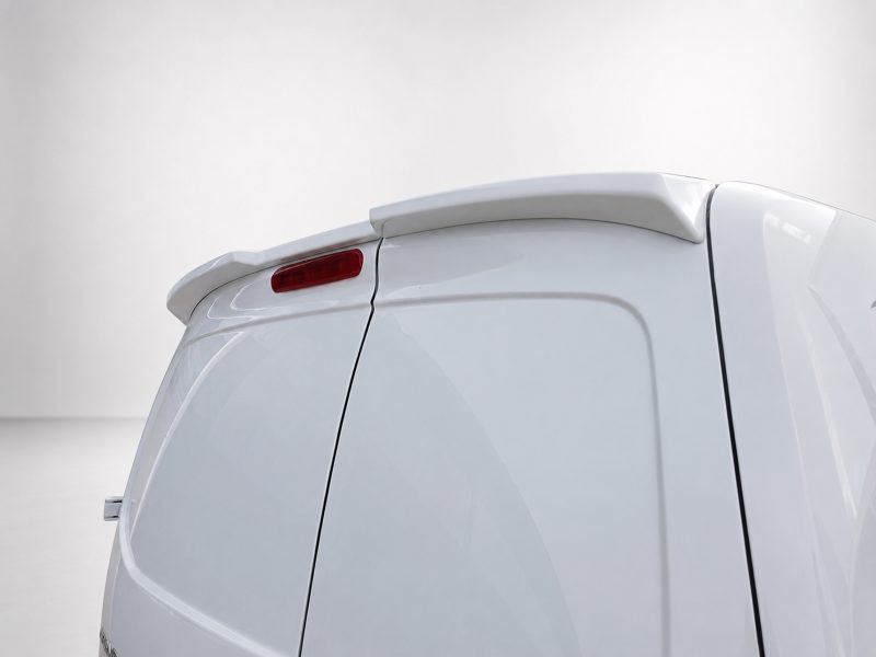 Rear section of a white van with a small roof spoiler and red tail light along the back edge.