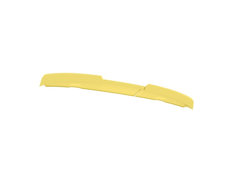 Long yellow curved plastic strip with subtle ridges on a white background