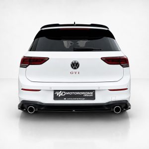 A-496_3jpg - OPSHOLDERS Rear view of a white Volkswagen GTI hatchback in a studio, showing red tail lights and dual exhausts.