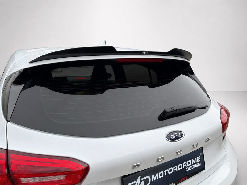 A-497_5jpg - OPSHOLDERS Rear view of a white Ford SUV with a black roof spoiler and rear wiper on the rear window.