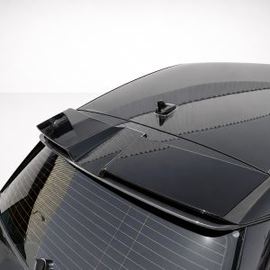 Rear view of a dark gray car showing the roof spoiler and antenna on a clean studio background.