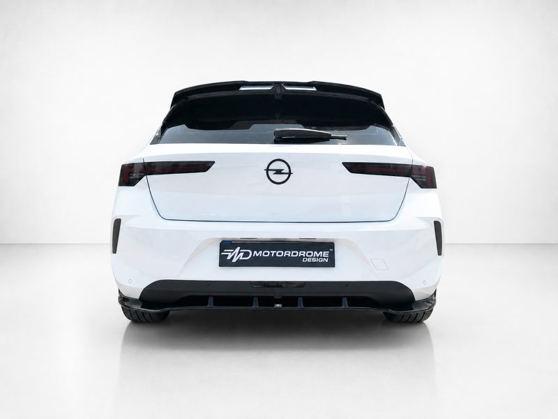 A-501_4jpg - OPSHOLDERS Rear view of a white hatchback with a black roof spoiler, Opel emblem, and a Motordrome Design license plate in a studio setting.