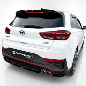 A-502_2jpg - OPSHOLDERS Rear view of a white Hyundai i30 hatchback in a studio setting, showing red taillights and a black rear spoiler with a red trim.