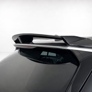 Close-up of a sleek car rear spoiler mounted above the rear window on a dark gray vehicle with glossy black panels.