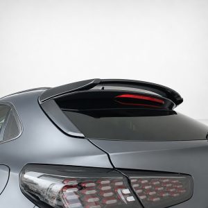 Rear view of a metallic gray car featuring a raised rear spoiler and stylish LED taillights.