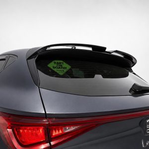 Gray SUV rear with roof spoiler and a green 'BABY ON BOARD' sticker on the rear window
