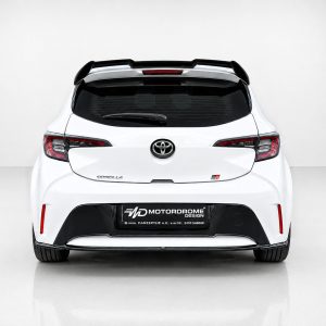A-511_4jpg - OPSHOLDERS Rear view of a white Toyota Corolla hatchback in a minimalist studio, showing the taillights, rear window, and badge.