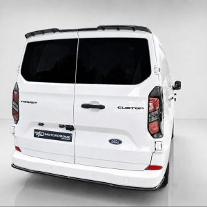 Rear view of a white Ford Transit Custom van with dark-tinted rear windows and a MotorDrome Design plate.