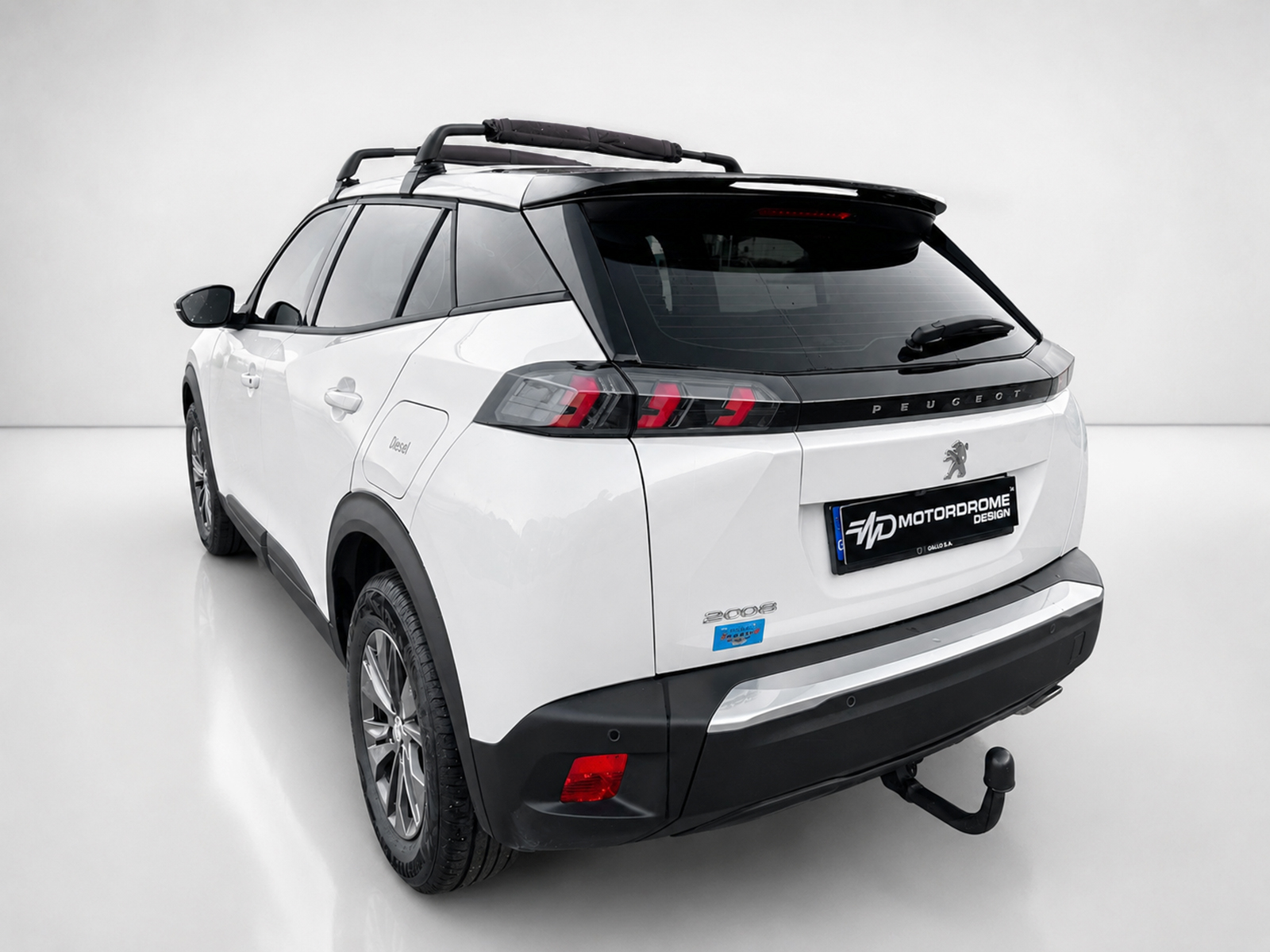 A-513_2jpg - OPSHOLDERS Rear three-quarter view of a white Peugeot SUV with black roof panels, a roof rack, and prominent taillights in a studio setting.
