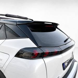 A-513_5jpg - OPSHOLDERS Rear quarter view of a white SUV showing a black roof rack and rear wiper on the rear window