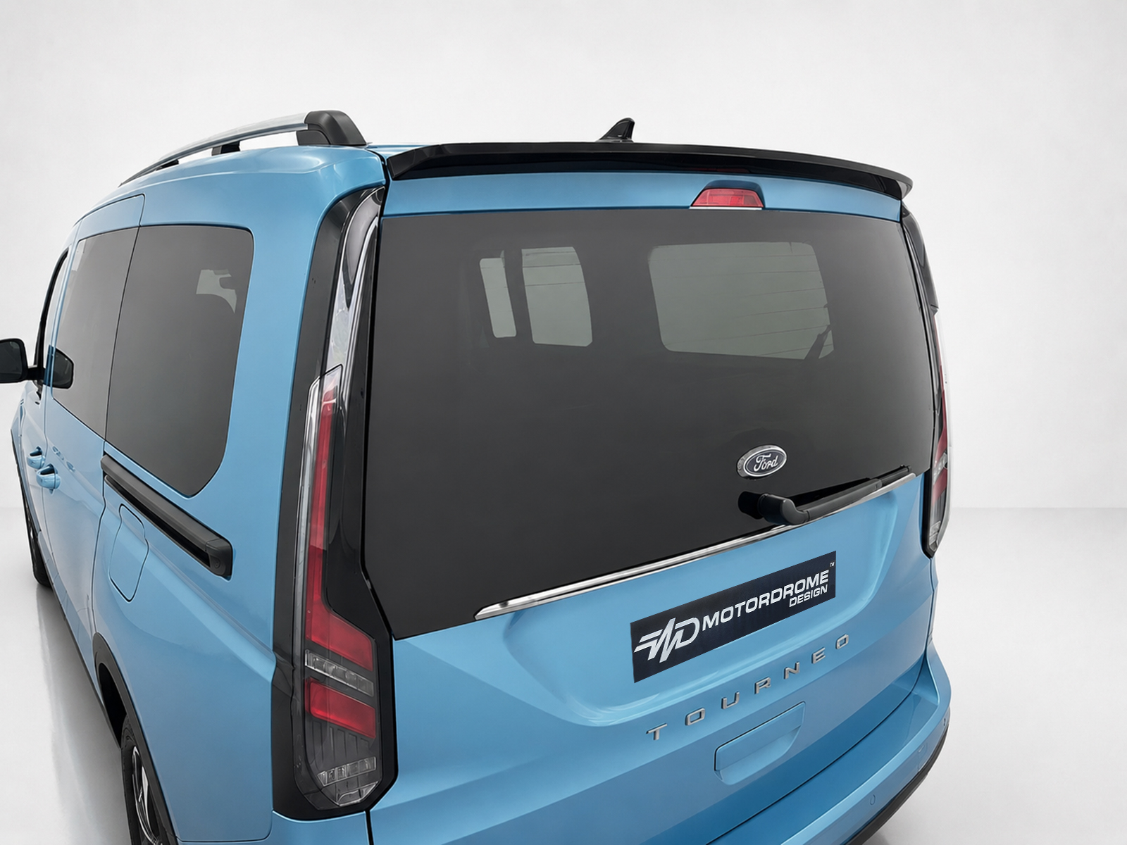 A-516_1jpg - OPSHOLDERS Rear three-quarter view of a blue Ford Tourneo van with a large dark rear window and wiper.