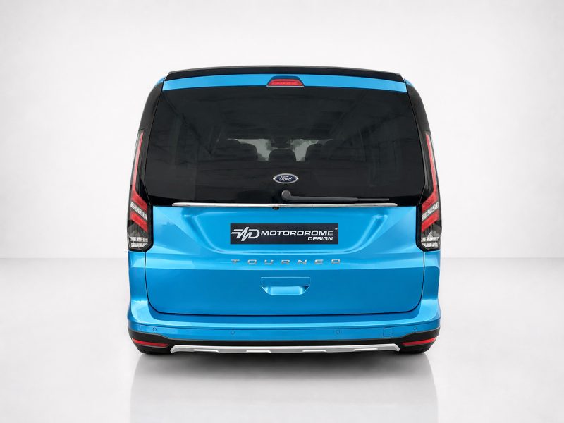 A-516_3jpg - OPSHOLDERS Rear view of a bright blue Ford Tourneo van with a Motordrome Design logo on the tailgate.