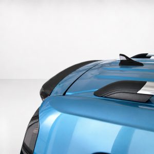 A-516_4jpg - OPSHOLDERS Close-up of a blue car's hood and roof with black accents and roof rails visible on the right side.